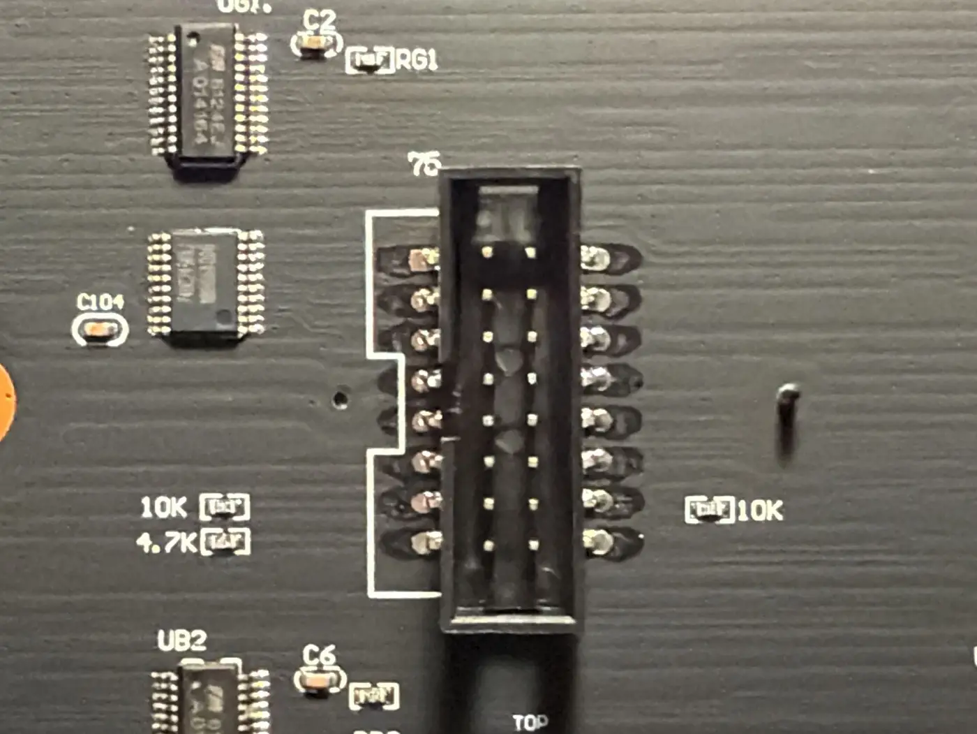 The back of an LED panel: the HUB75 input connector with two small buffer chips beside it