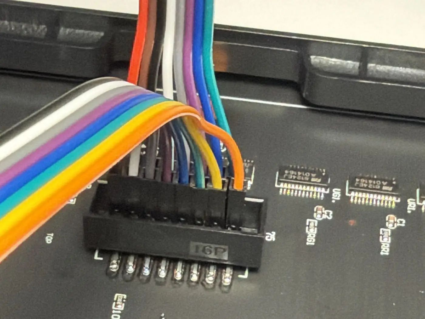 Rainbow jumper wires pushed into the panel's input connector