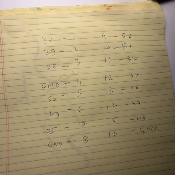 Handwritten pin map on a yellow legal pad, connector pins matched to GPIO numbers